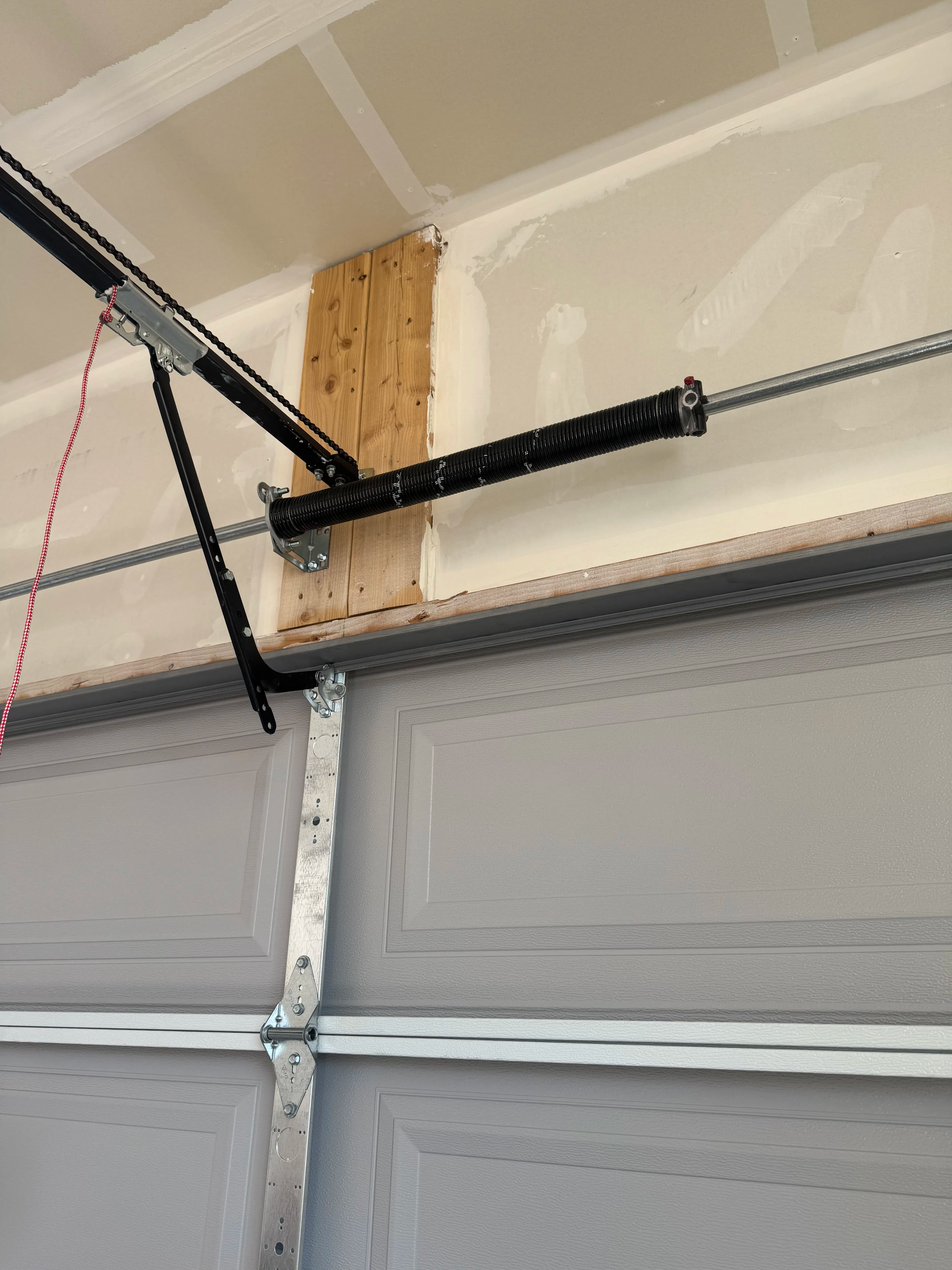Project Worn Garage Door Spring Repaired and Running Smooth Again image