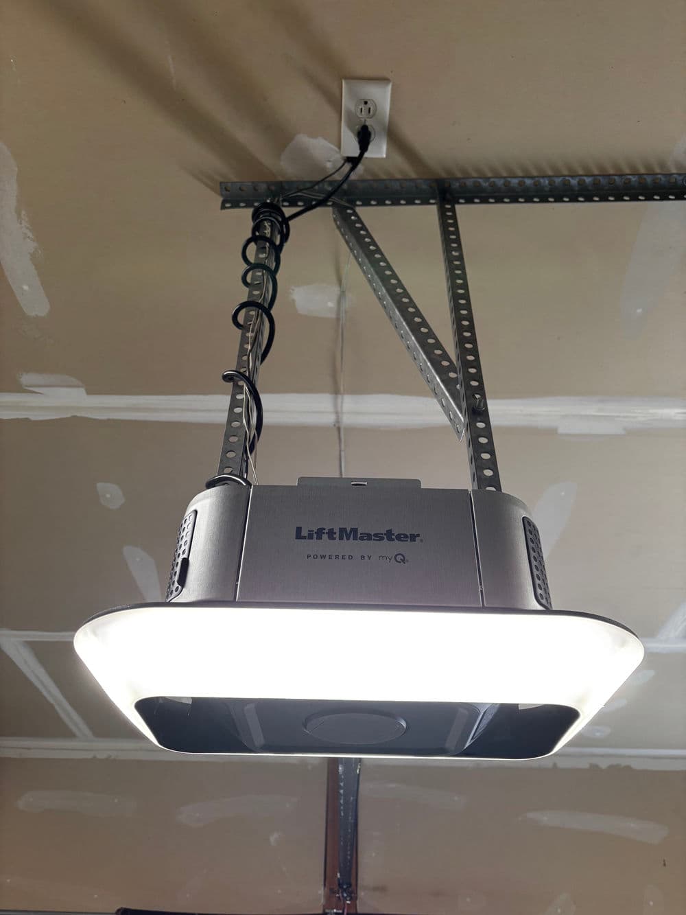 LiftMaster garage door opener with LED light installed in ceiling, powered by MyQ technology.