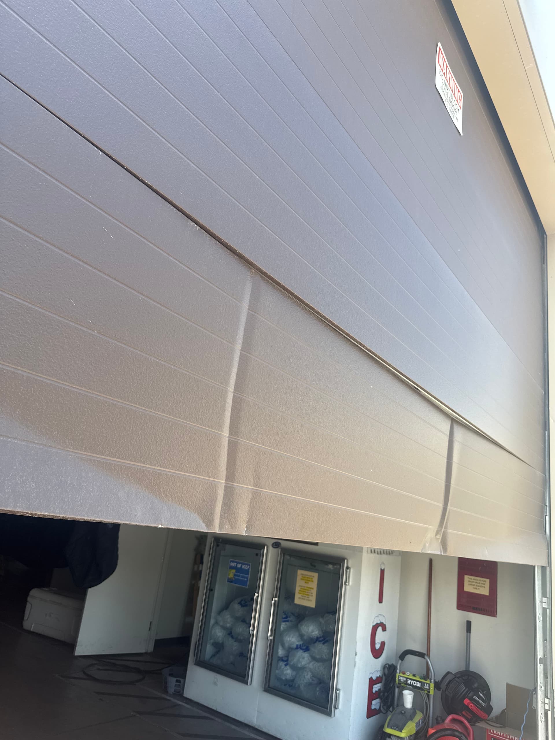 Commercial Garage Door Panel Replacement After Impact Damage image